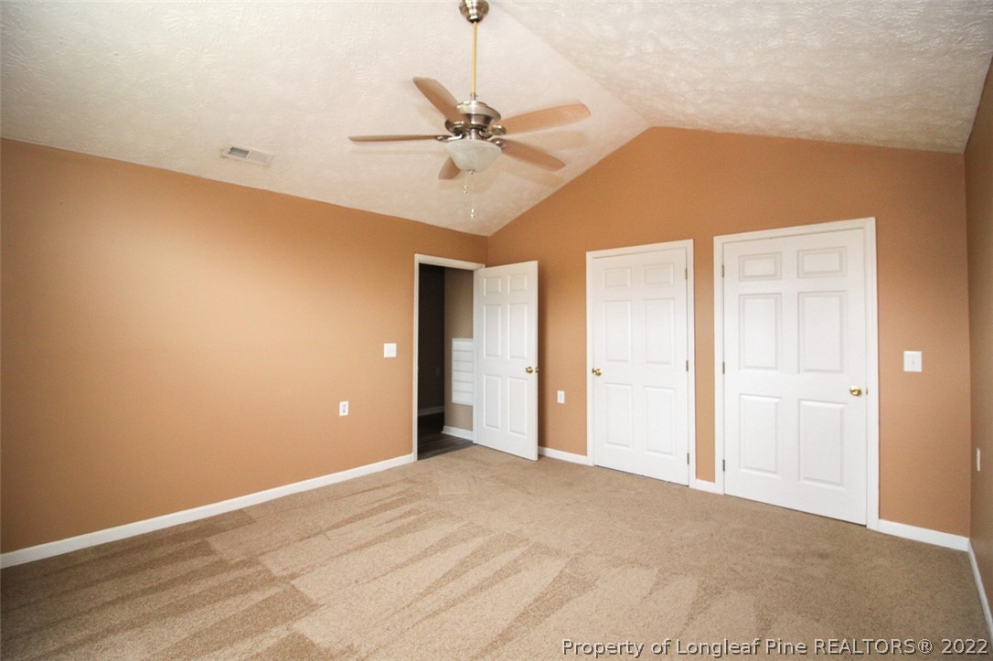220 Overton Road Raeford, NC 28376 - Photo 21 of 30 a view of an empty room with a ceiling fan