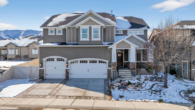 14714 South Bright Wood Road Herriman, UT 84096 - Photo 2 of 41 Craftsman house featuring a gate, stone siding, a garage, concrete driveway, and stucco siding