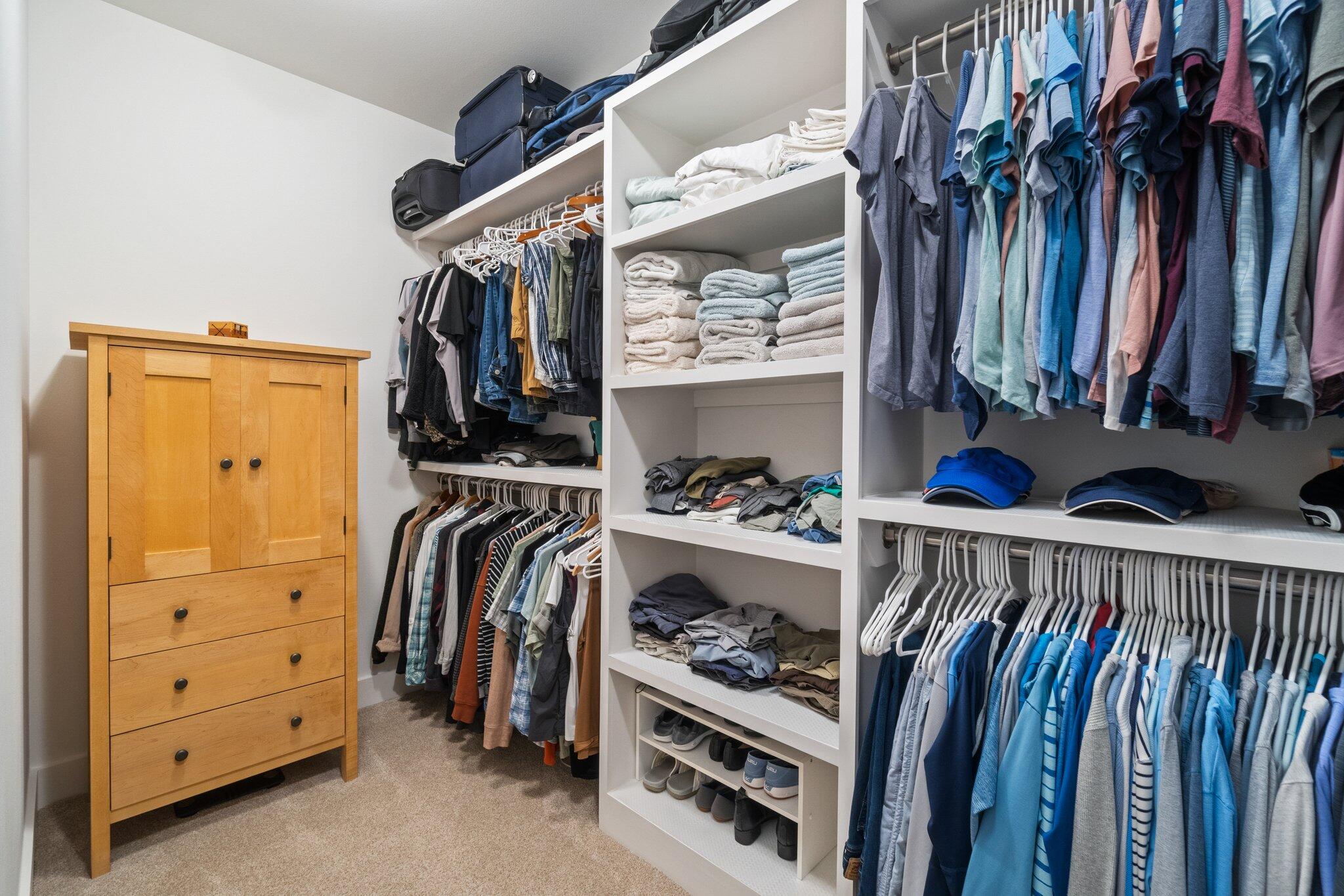 95 Log Landing St Inlet Beach Inlet Beach, FL 32461 - Photo 37 of 59 a view of walk in closet with clothes and shoes