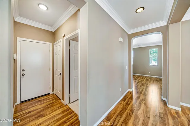 a kitchen with stainless steel appliances granite countertop a refrigerator oven a sink a counter top space and cabinets