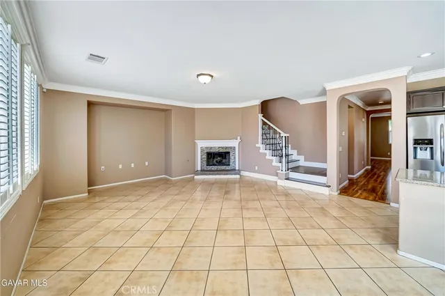 a large kitchen with cabinets and stainless steel appliances