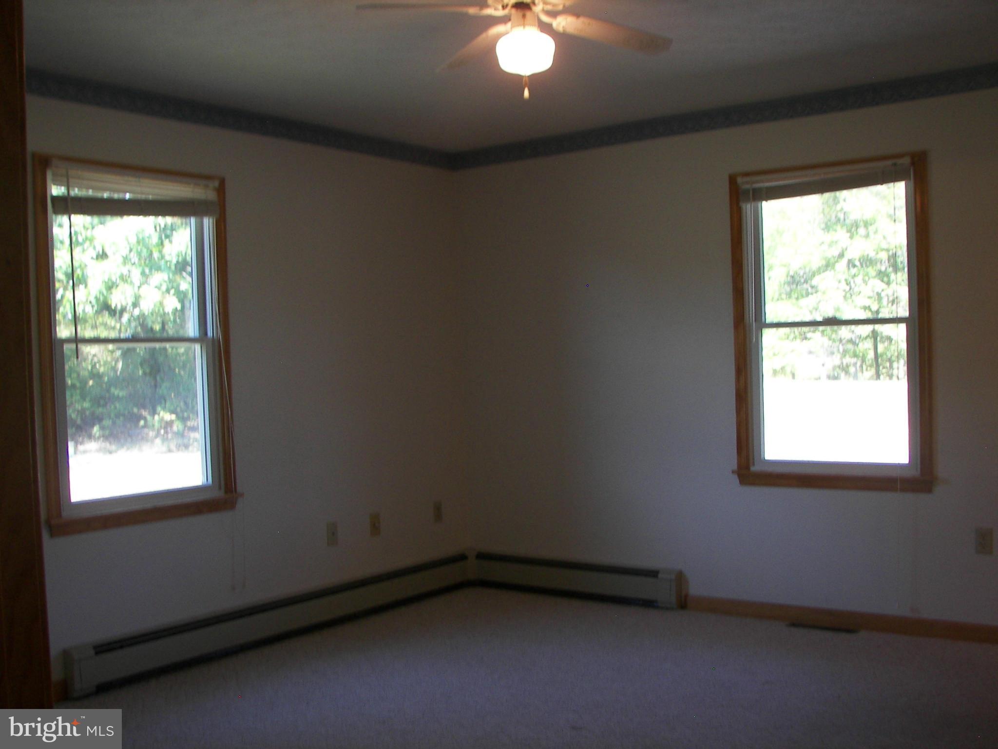 2483 Potomac Road Berkeley Springs, WV 25411 - Photo 17 of 30 an empty room with a window