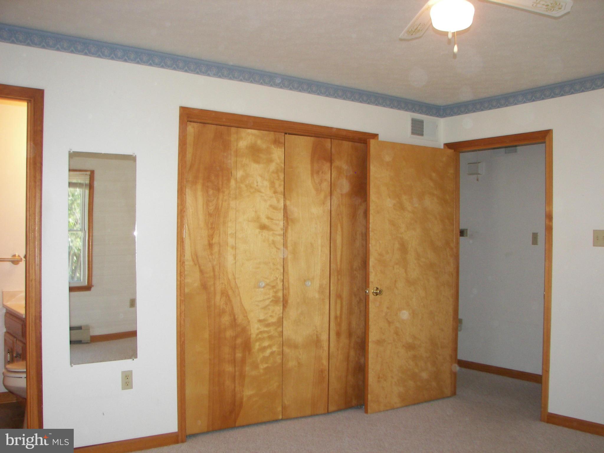 2483 Potomac Road Berkeley Springs, WV 25411 - Photo 18 of 30 a view of a livingroom with a chandelier fan