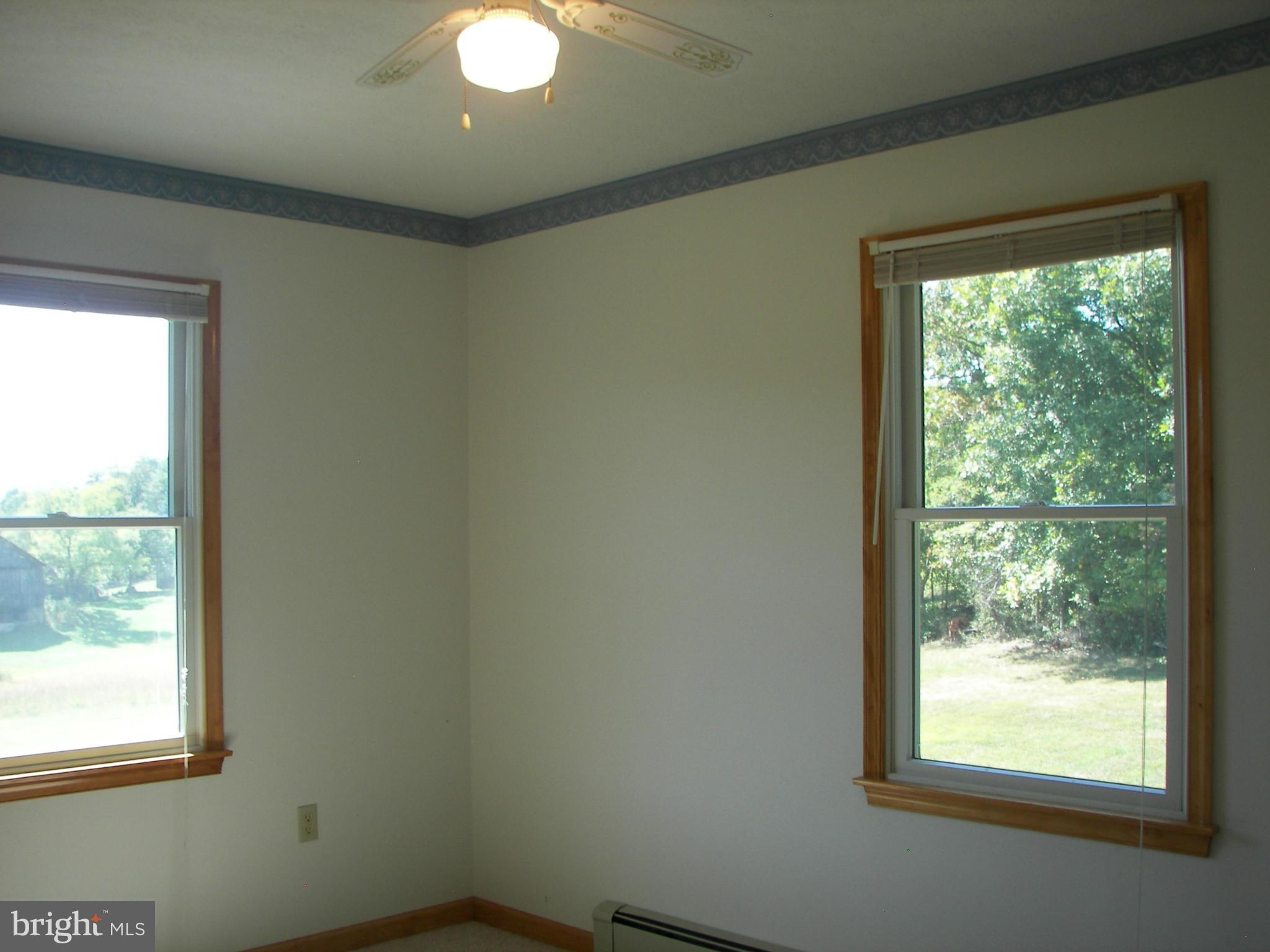 2483 Potomac Road Berkeley Springs, WV 25411 - Photo 22 of 30 a view of an empty room with a window
