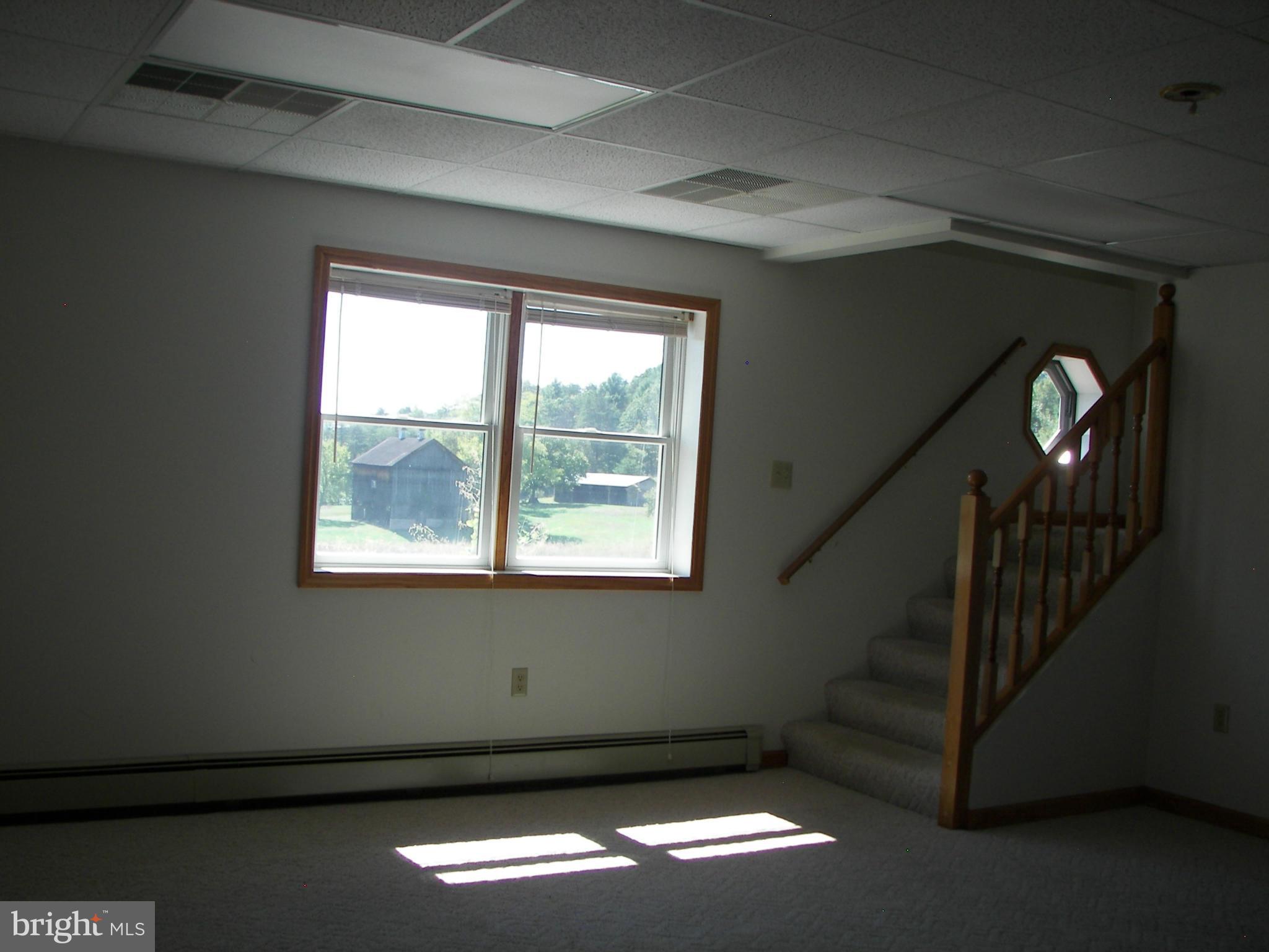 2483 Potomac Road Berkeley Springs, WV 25411 - Photo 24 of 30 a view of room with window
