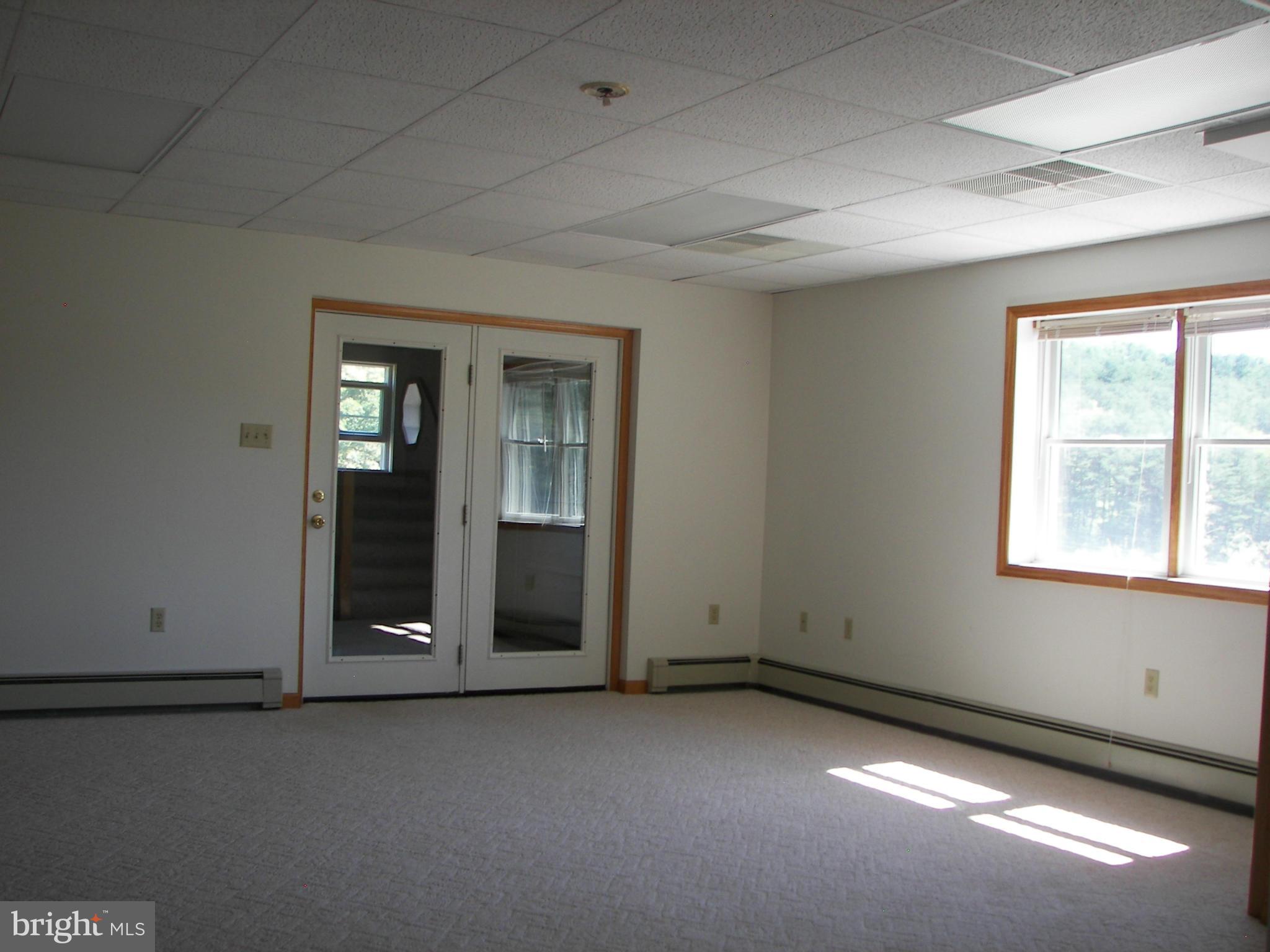 2483 Potomac Road Berkeley Springs, WV 25411 - Photo 28 of 30 an empty room with windows