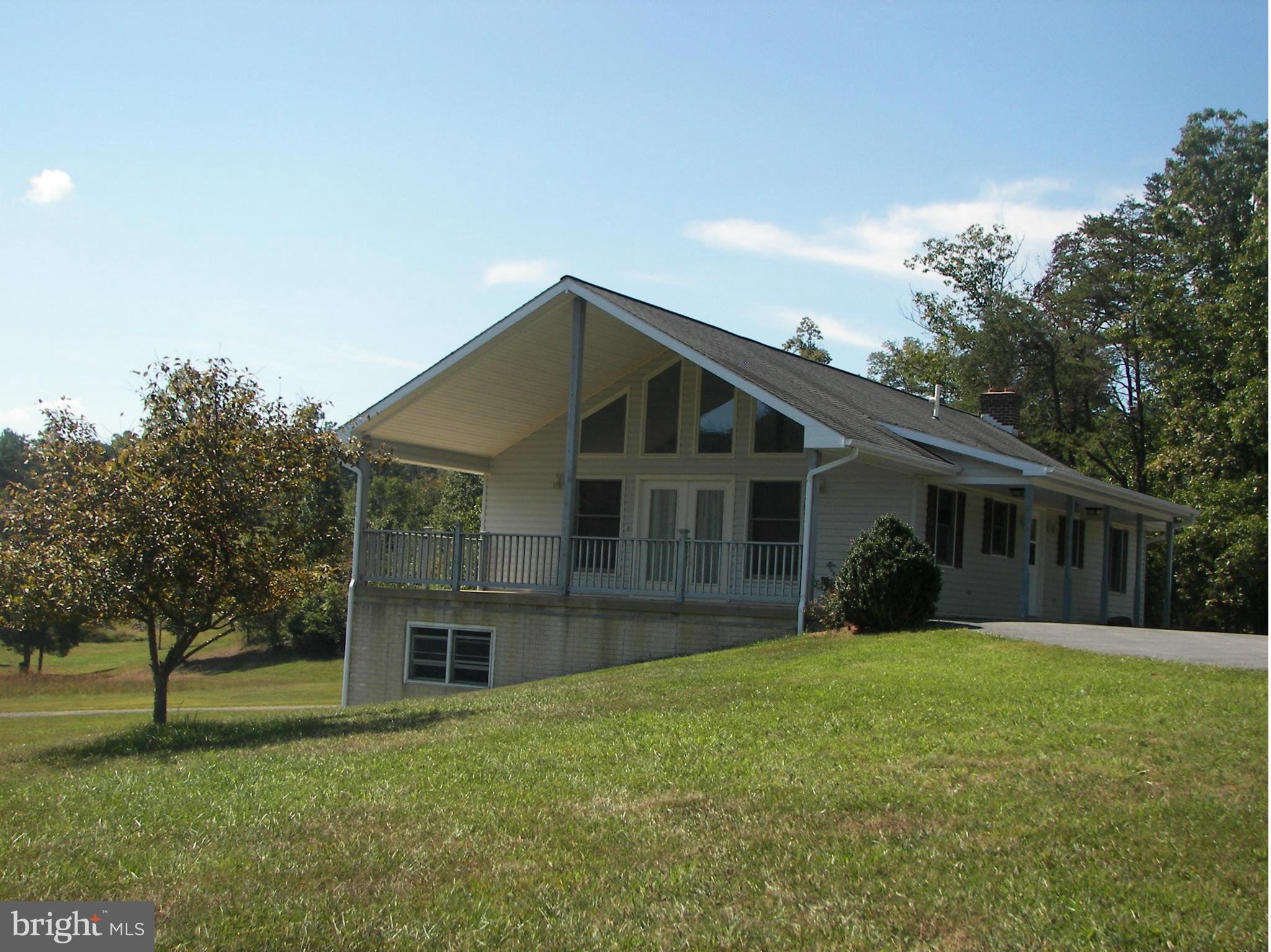 2483 Potomac Road Berkeley Springs, WV 25411 - Photo 30 of 30 a front view of house with yard and green space