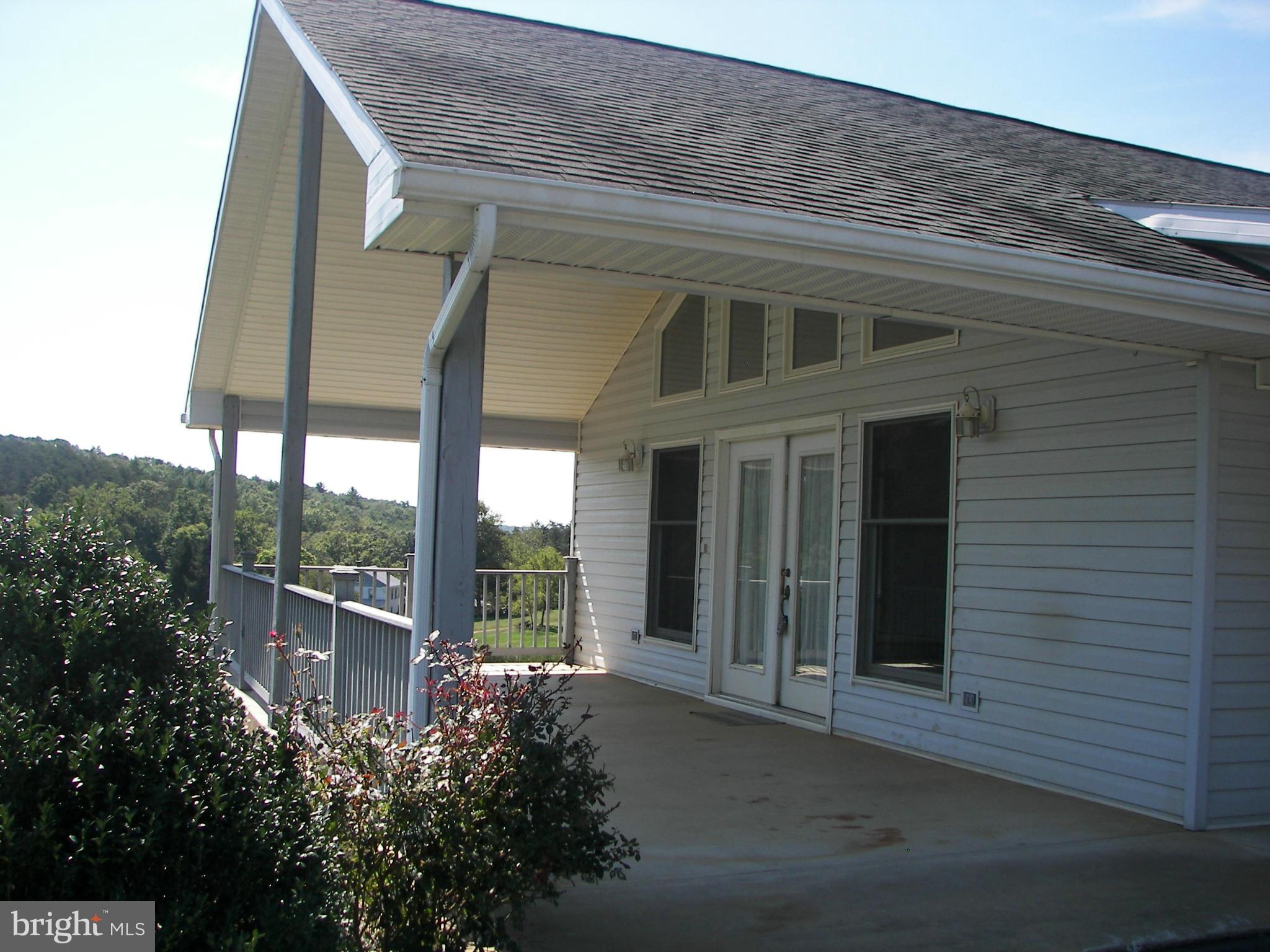 2483 Potomac Road Berkeley Springs, WV 25411 - Photo 6 of 30 a view of a house with a porch