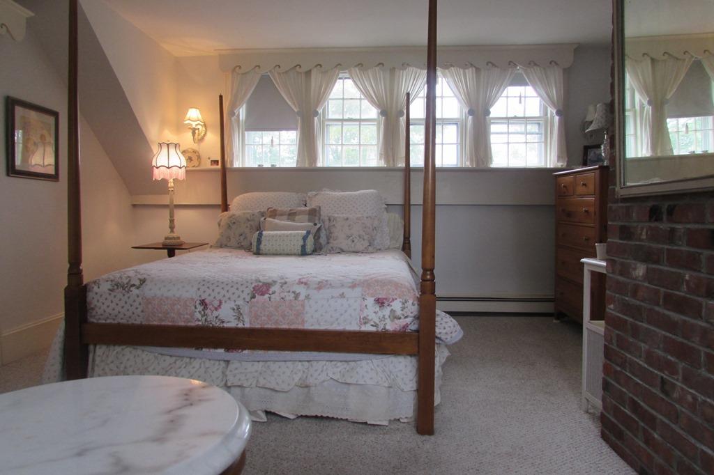 63 Cross Street Chatham, MA 02633 - Photo 12 of 20 a bedroom with a bed and a mirror
