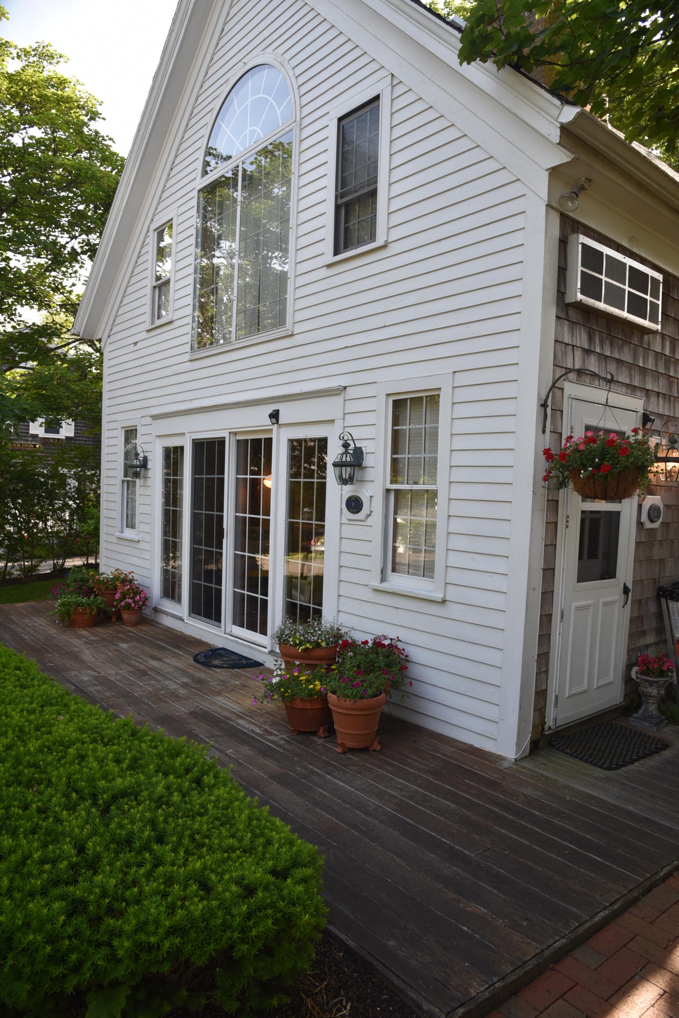 63 Cross Street Chatham, MA 02633 - Photo 15 of 20 a front view of a house with a yard