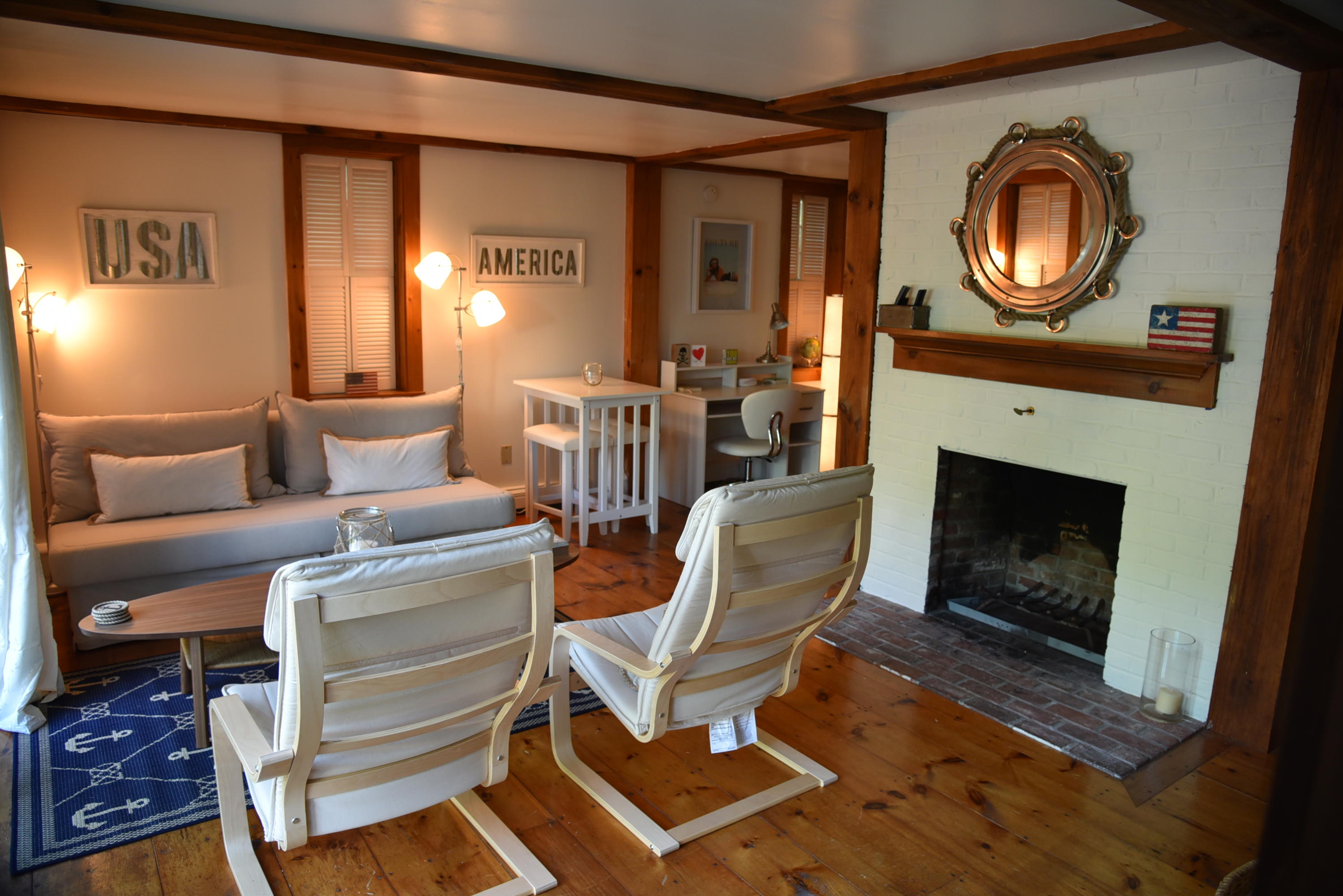 63 Cross Street Chatham, MA 02633 - Photo 16 of 20 a living room with furniture a window and a fireplace