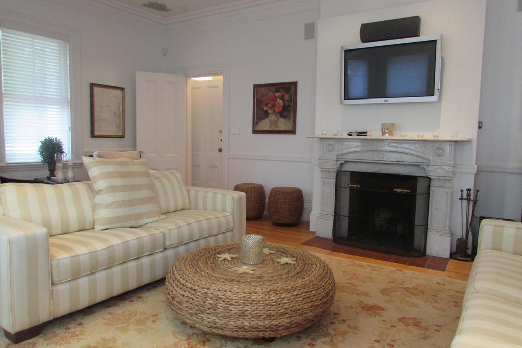 63 Cross Street Chatham, MA 02633 - Photo 4 of 20 a living room with furniture and a fireplace
