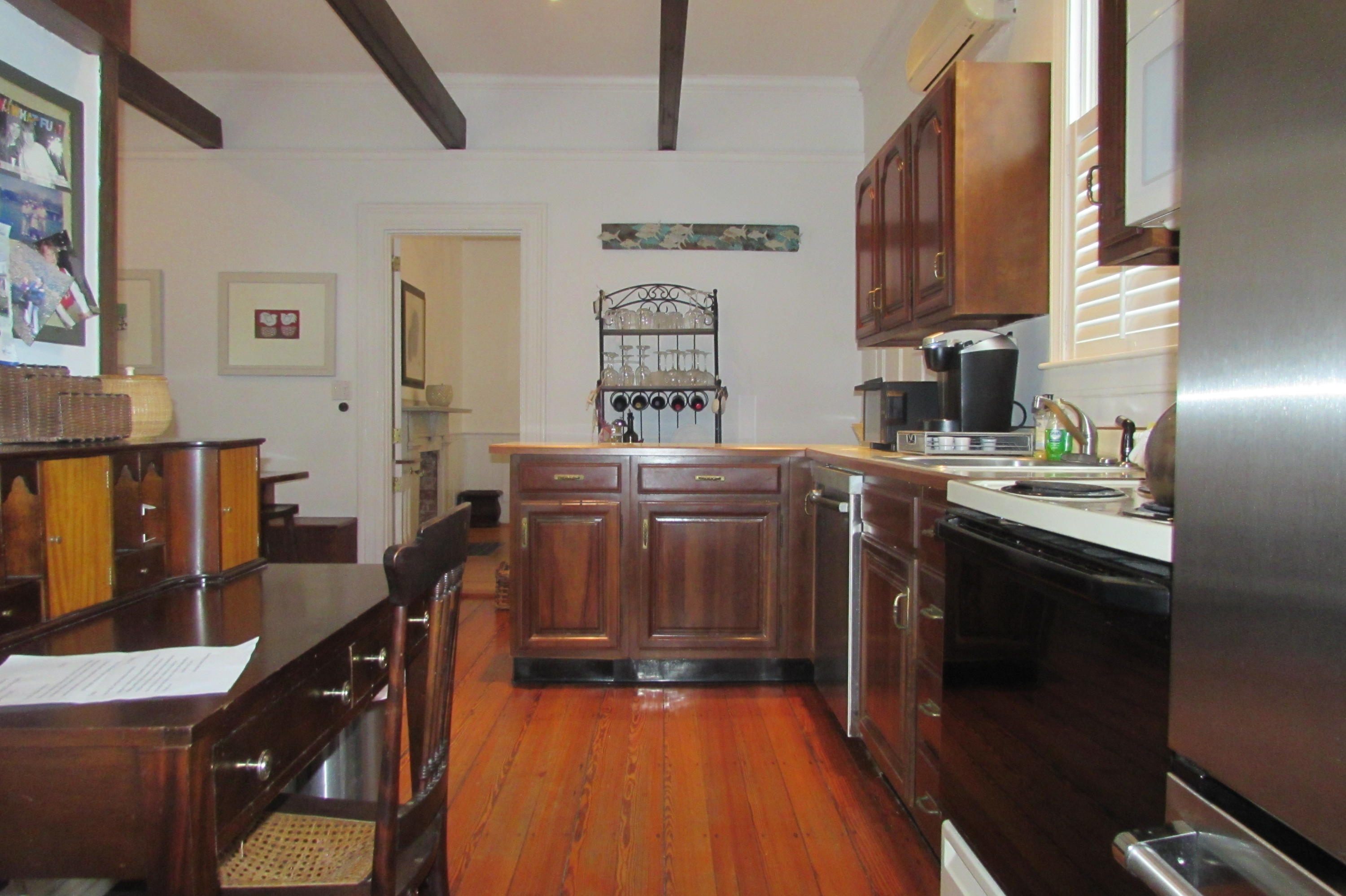 63 Cross Street Chatham, MA 02633 - Photo 8 of 20 a kitchen with stainless steel appliances granite countertop a stove a sink dishwasher and a microwave oven with cabinets