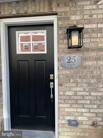 a view of a brick building next to a road