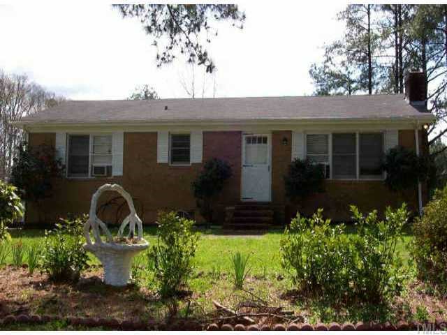 3805 Barwell Road Raleigh, NC 27610 - Photo 1 of 1 a front view of a house with garden