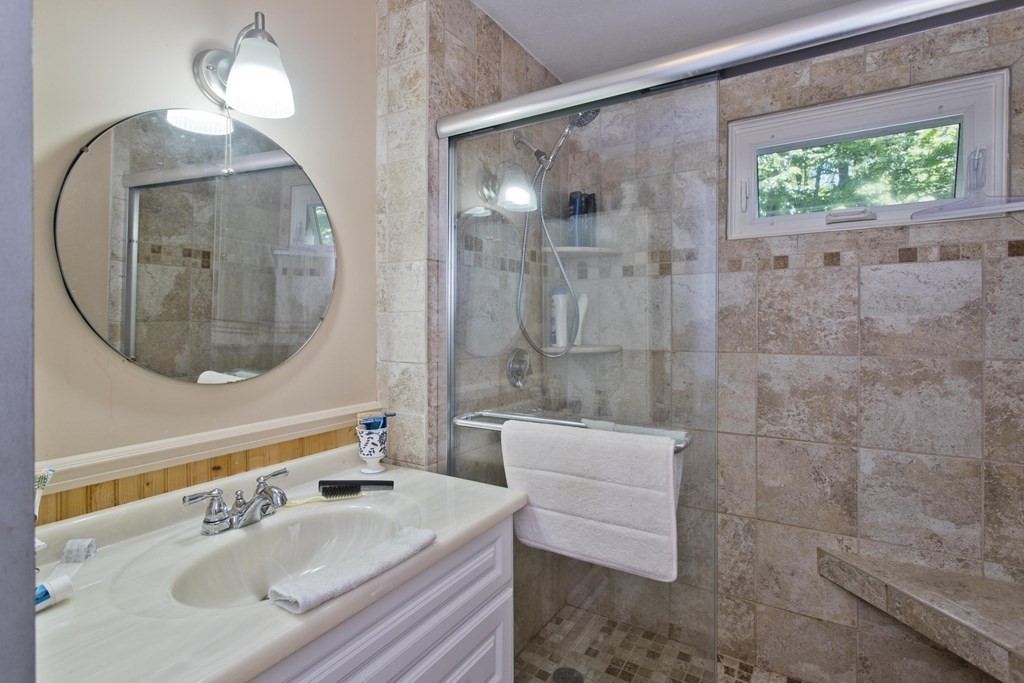 17 Path Road Tolland, MA 01034 - Photo 17 of 29 a bathroom with a sink a toilet and a mirror
