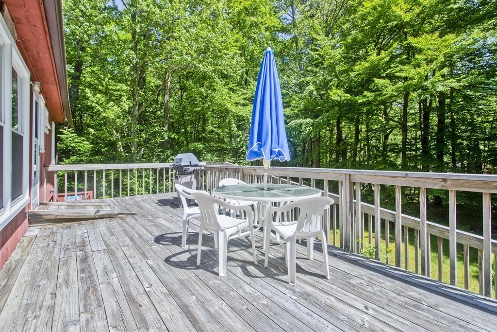 17 Path Road Tolland, MA 01034 - Photo 6 of 29 a view of a deck with furniture and wooden floor