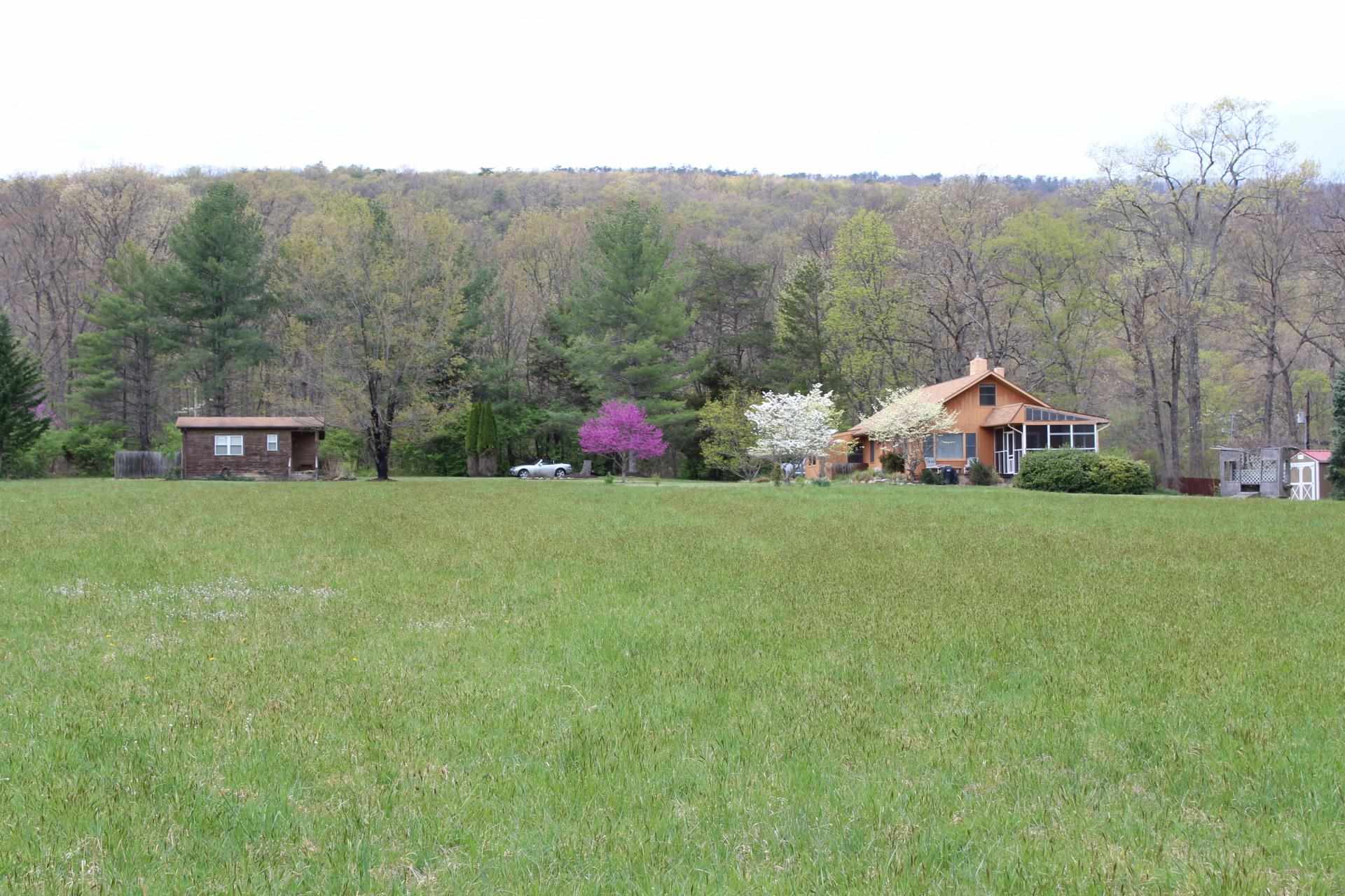 1076 Fort Valley Road Fort Valley, VA 22652 - Photo 1 of 54 a view of a house with a yard and garden