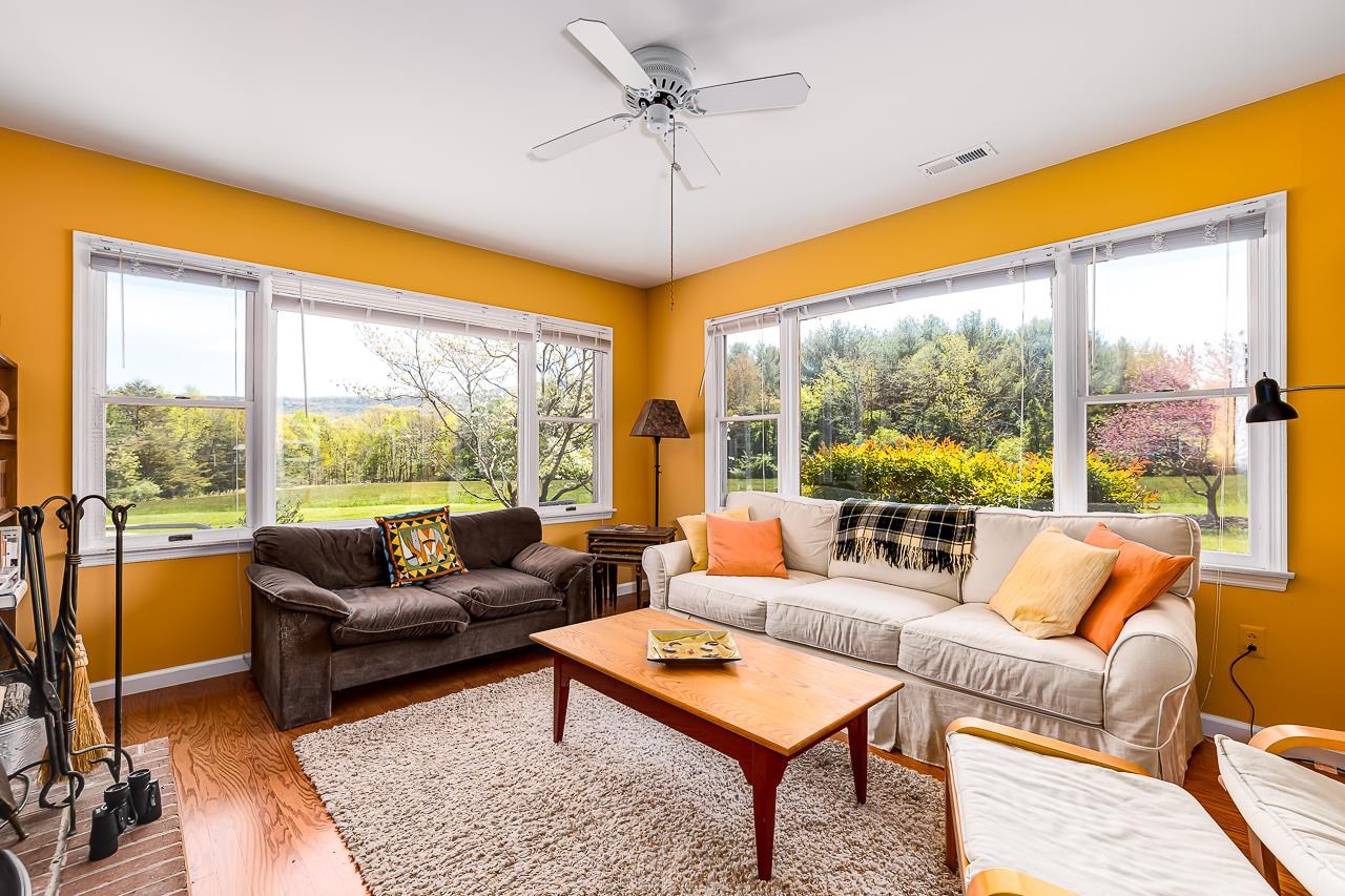 1076 Fort Valley Road Fort Valley, VA 22652 - Photo 11 of 54 a living room with furniture and a large window