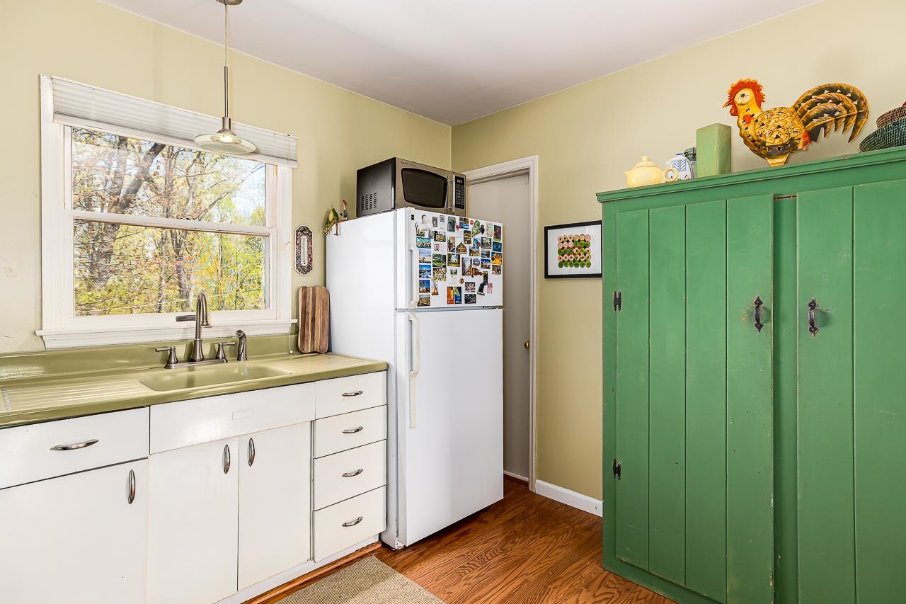 1076 Fort Valley Road Fort Valley, VA 22652 - Photo 15 of 54 a kitchen with a refrigerator a sink and dishwasher with wooden floor