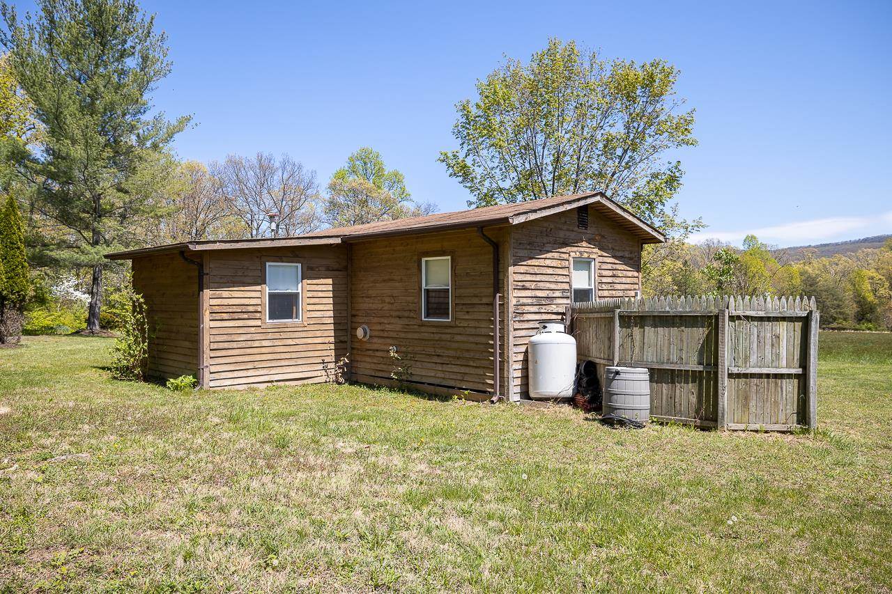 1076 Fort Valley Road Fort Valley, VA 22652 - Photo 42 of 54 a view of a house with a yard and garage