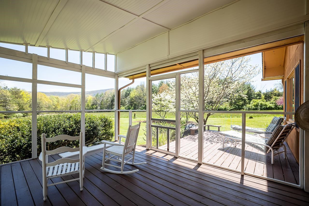 1076 Fort Valley Road Fort Valley, VA 22652 - Photo 5 of 54 a view of a balcony with lake view and a floor to ceiling window