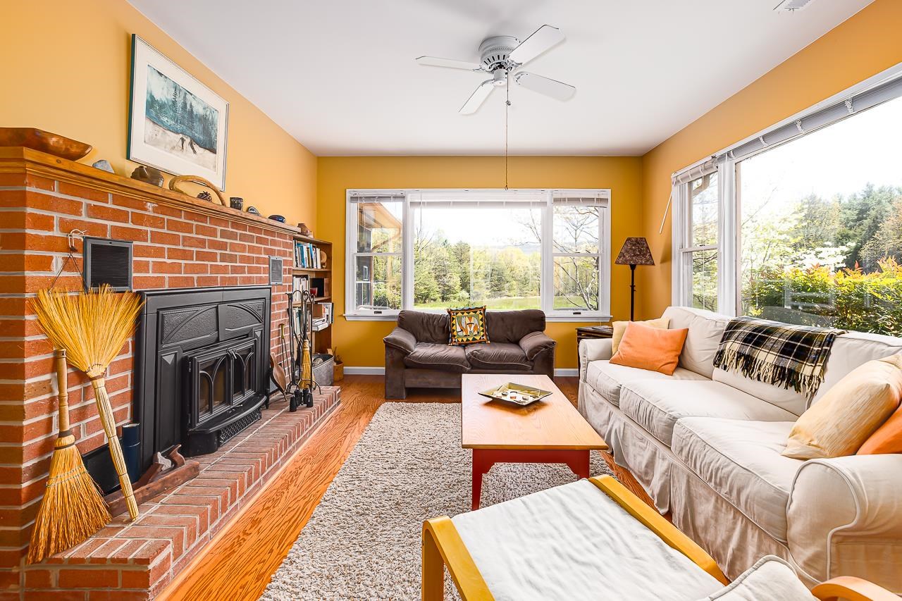 1076 Fort Valley Road Fort Valley, VA 22652 - Photo 6 of 54 a living room with furniture a fireplace and a large window