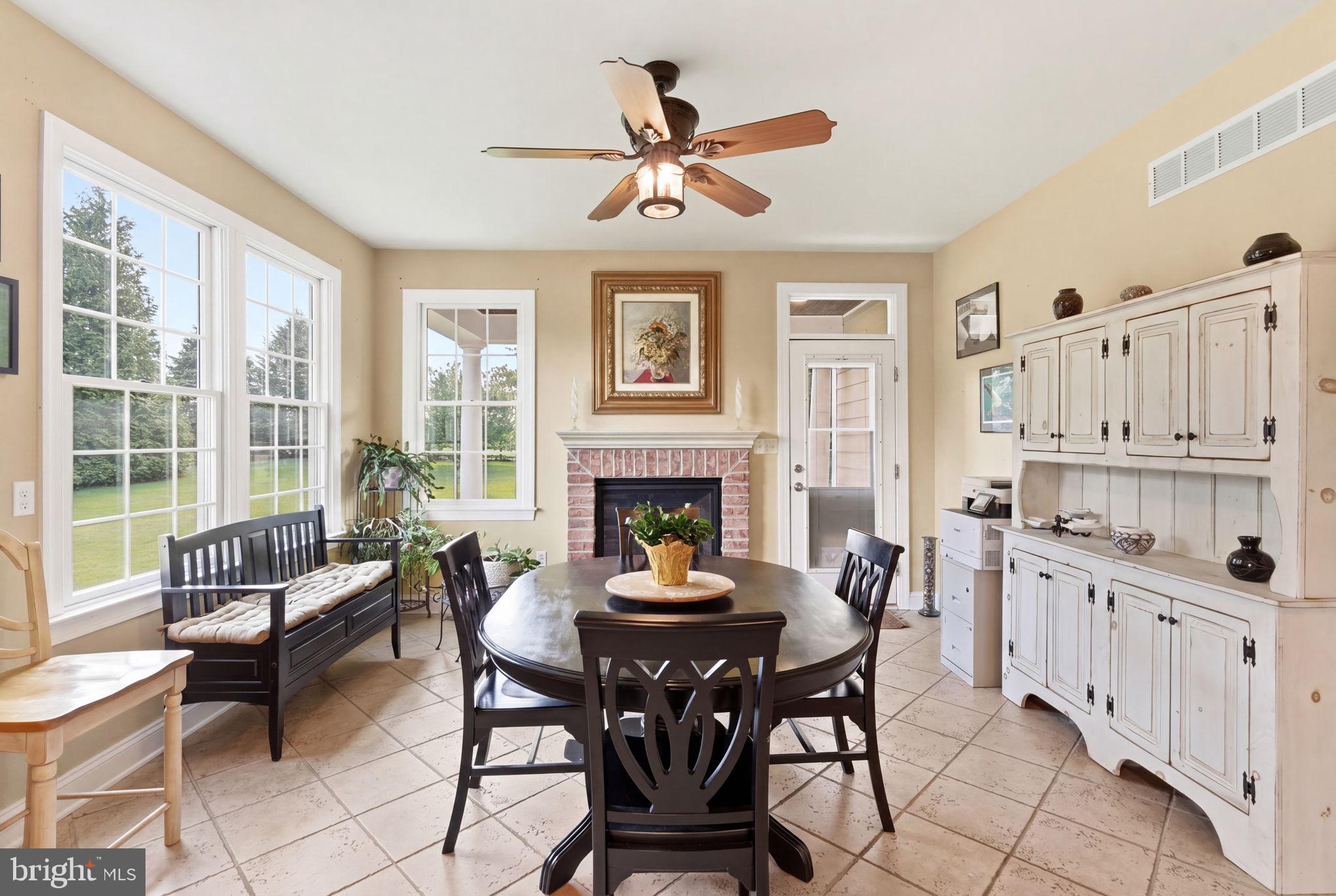 9 Deer Ridge Court Phoenix, MD 21131 - Photo 36 of 96 a living room with furniture a fireplace and a large window