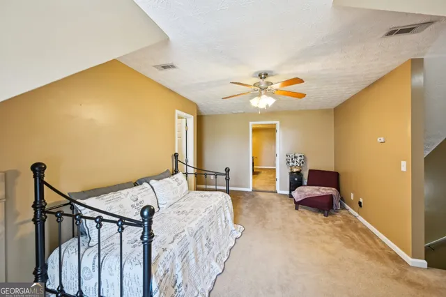 a view of hall way with furniture