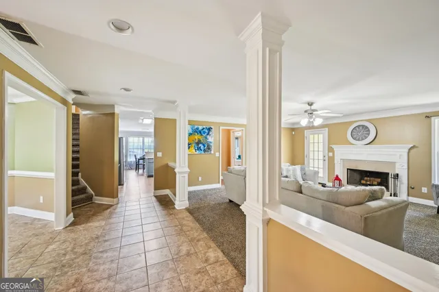 a living room with furniture and a fireplace