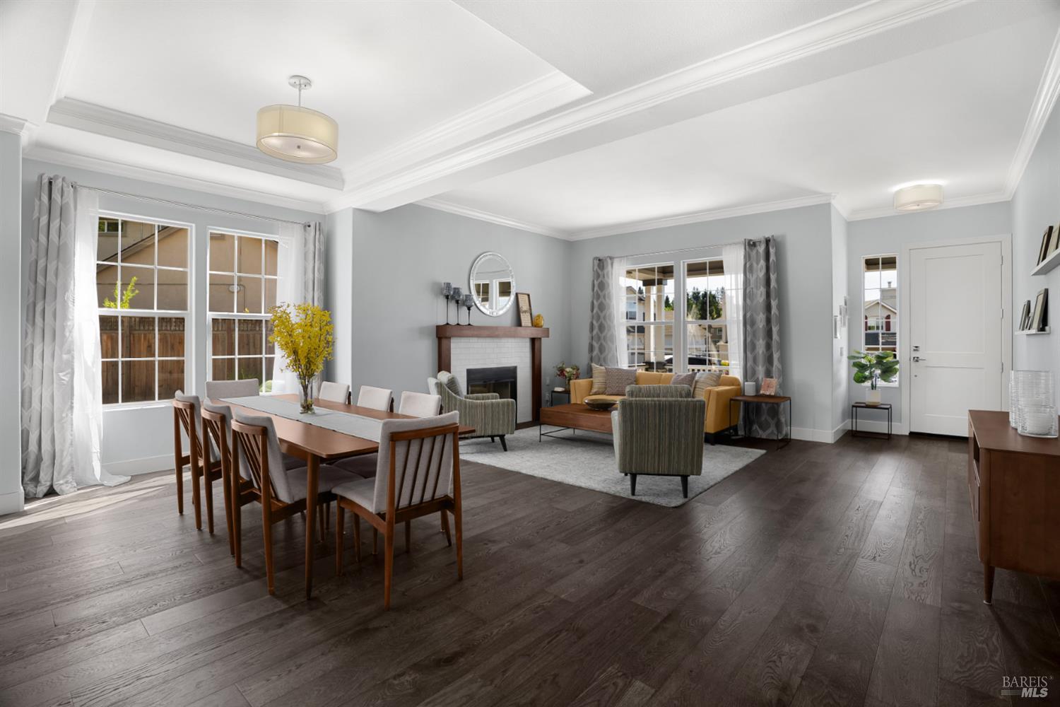 5909 Featherlight Place Santa Rosa, CA 95409 - Photo 14 of 50 Living room features crown molding, custom fireplace mantel, and energy-efficient LED lighting create a polished, inviting atmosphere.