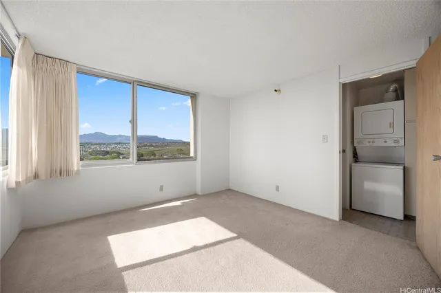 a view of an empty room with a window