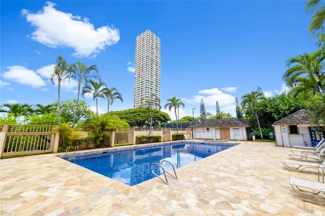a view of a swimming pool with a lounge chair