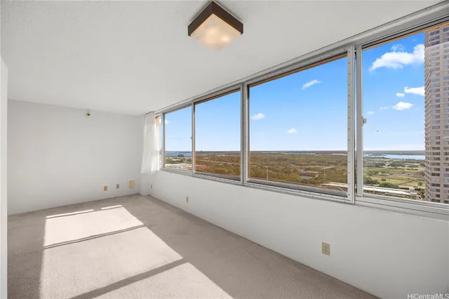 a view of an empty room with a window