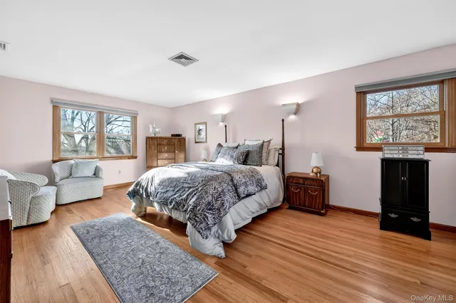 a spacious bedroom with a large bed and a couch