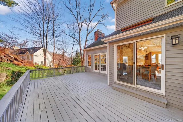 a view of backyard with brick wall and floor to ceiling window