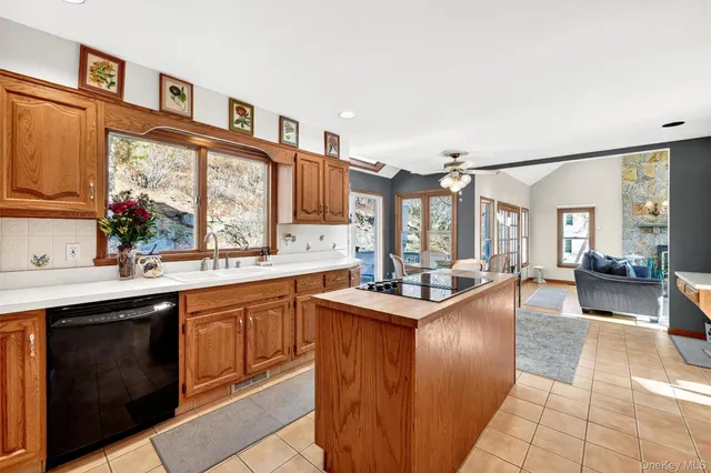 a kitchen with sink stove and cabinets