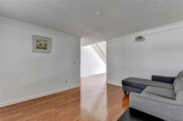 a kitchen with stainless steel appliances granite countertop a stove a sink dishwasher and a refrigerator