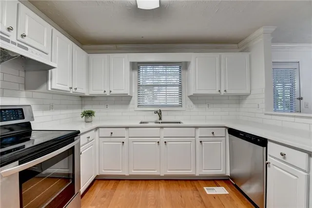 a view of a kitchen from the hallway