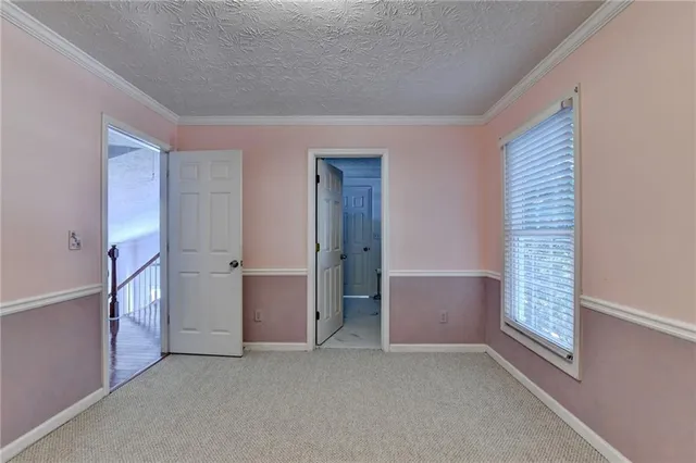 a room with a bed and window