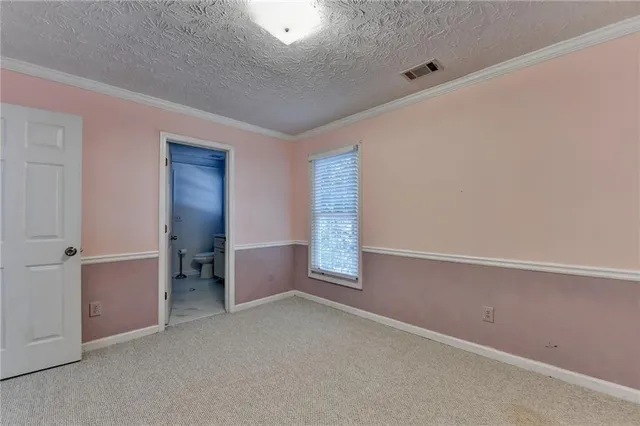 a bedroom with a bed and a tv