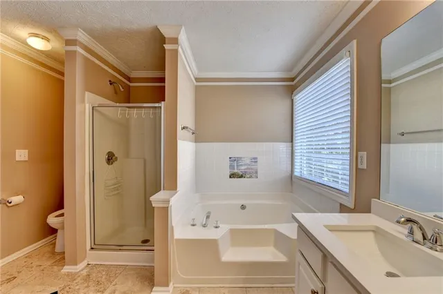 an empty room with a window and a ceiling fan