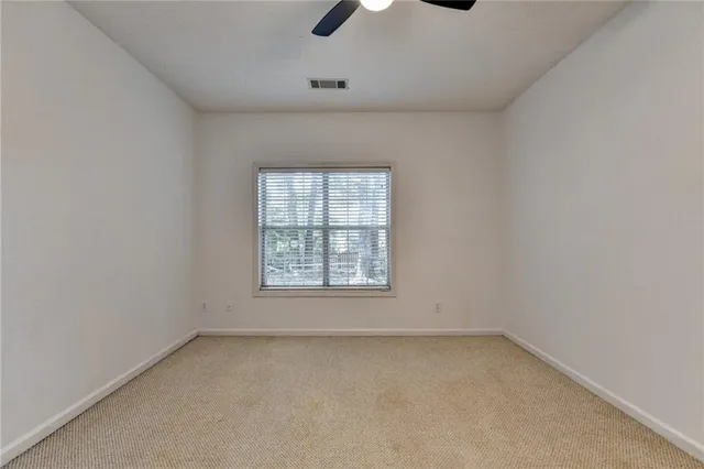 a view of a room with a tree in a yard