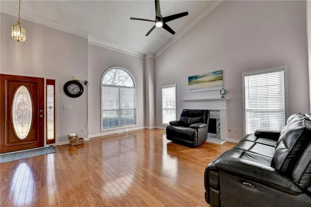 a view of an entryway with wooden floor
