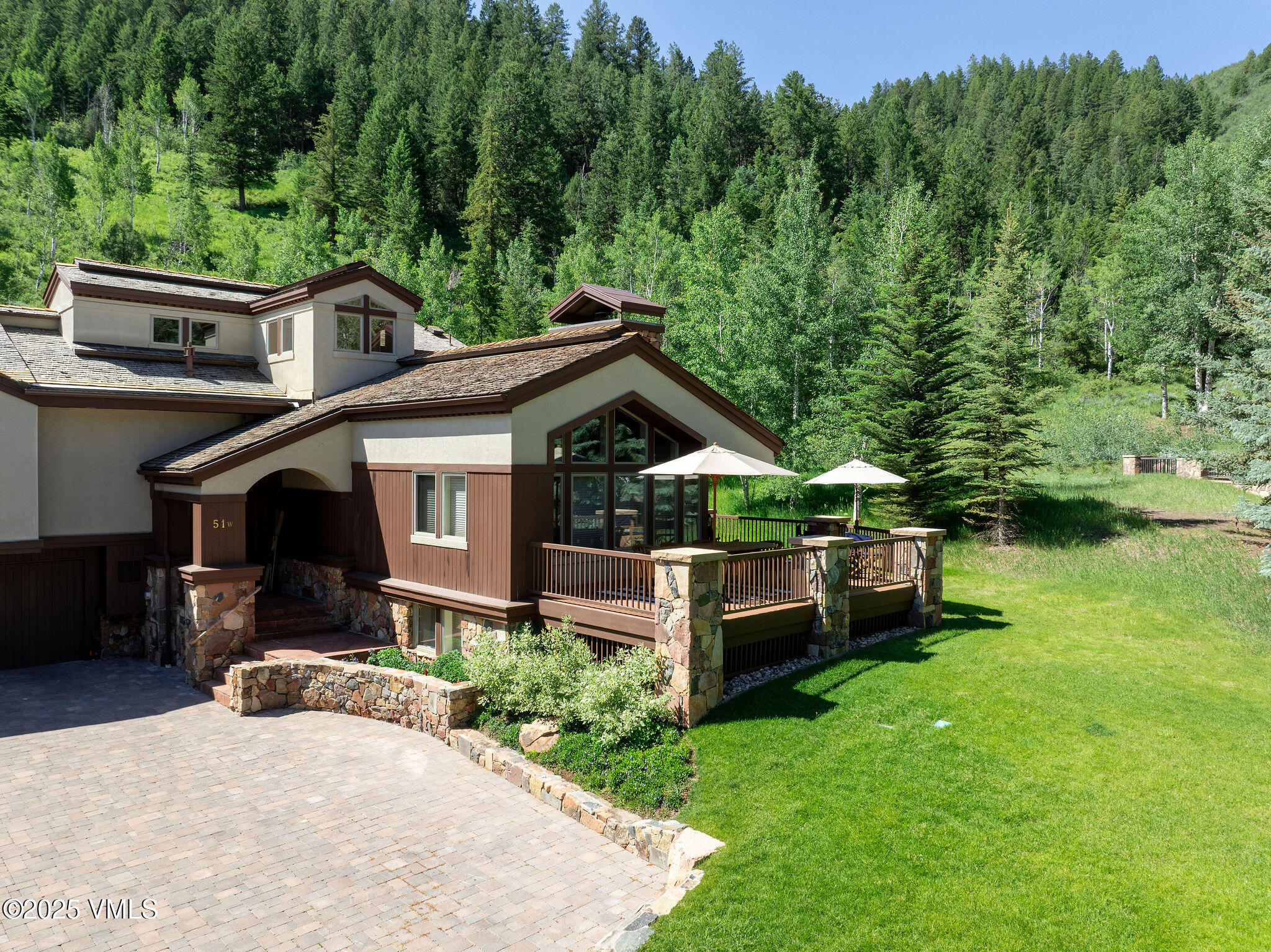 51 Hillside Court Edwards, CO 81632 - Photo 25 of 39 a front view of a house with a yard table and chairs