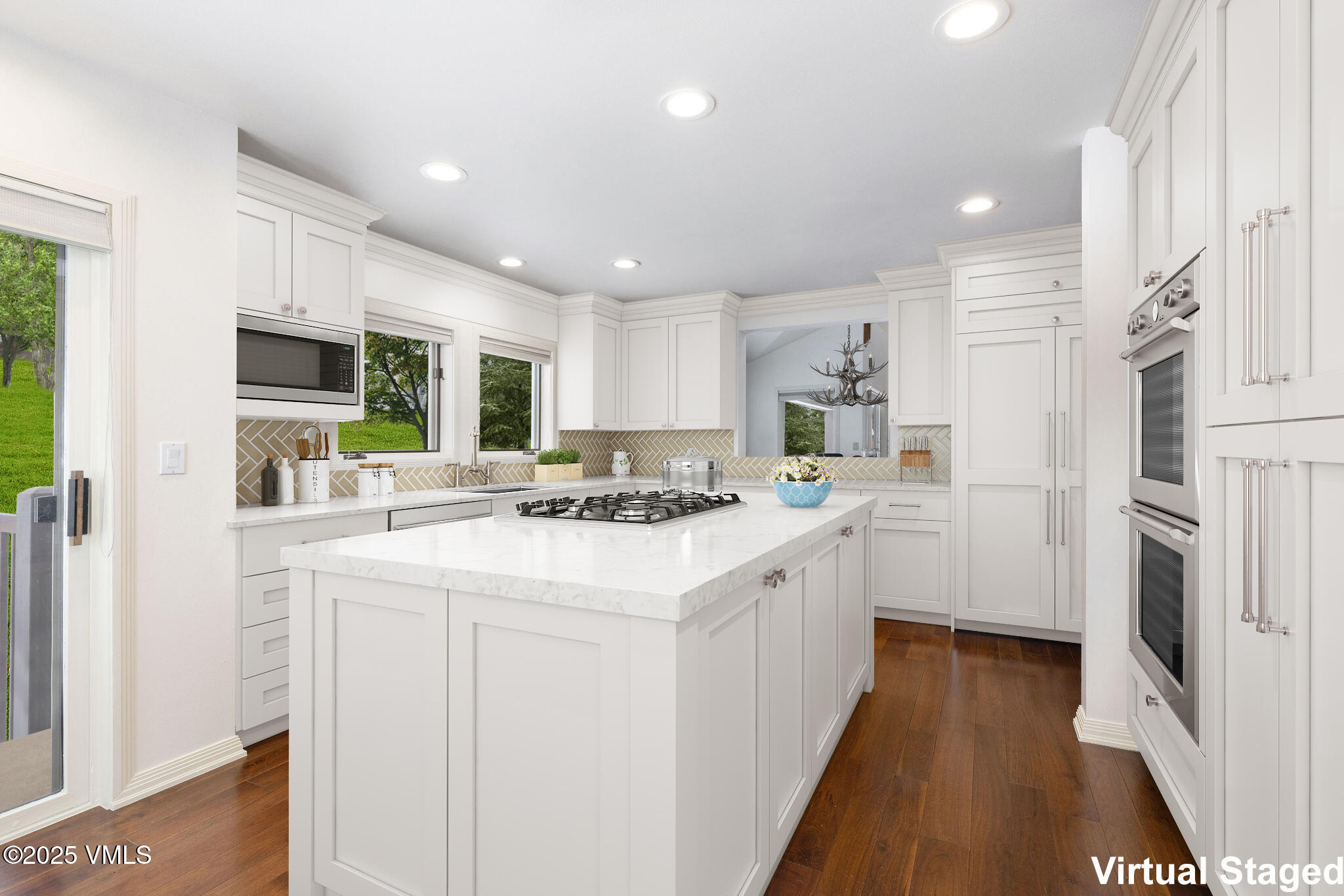 51 Hillside Court Edwards, CO 81632 - Photo 6 of 39 a kitchen with stainless steel appliances kitchen island granite countertop a sink and a refrigerator