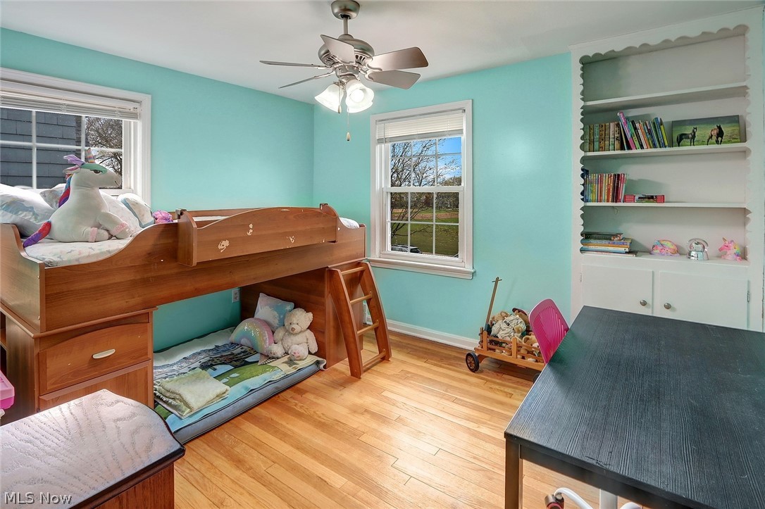 3573 Strandhill Road Shaker Heights, OH 44122 - Photo 19 of 25 Third bedroom with hardwood floor and built-in shelving.