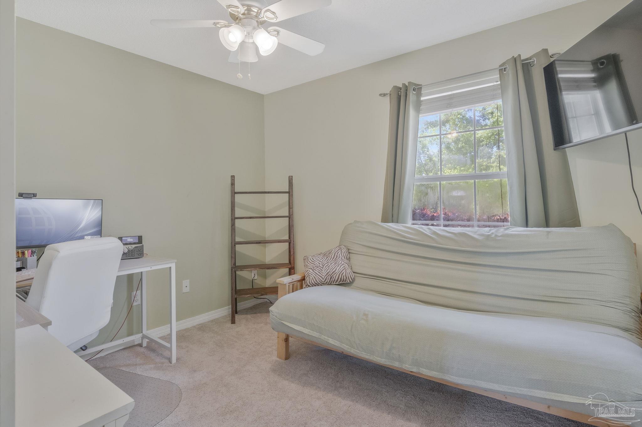 5539 Windrun Place Pace, FL 32571 - Photo 22 of 62 a bedroom with a bed and a window