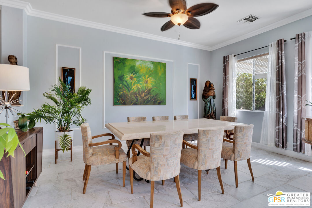 68315 Riviera Road Cathedral City, CA 92234 - Photo 13 of 33 a view of a dining room with furniture window and wooden floor