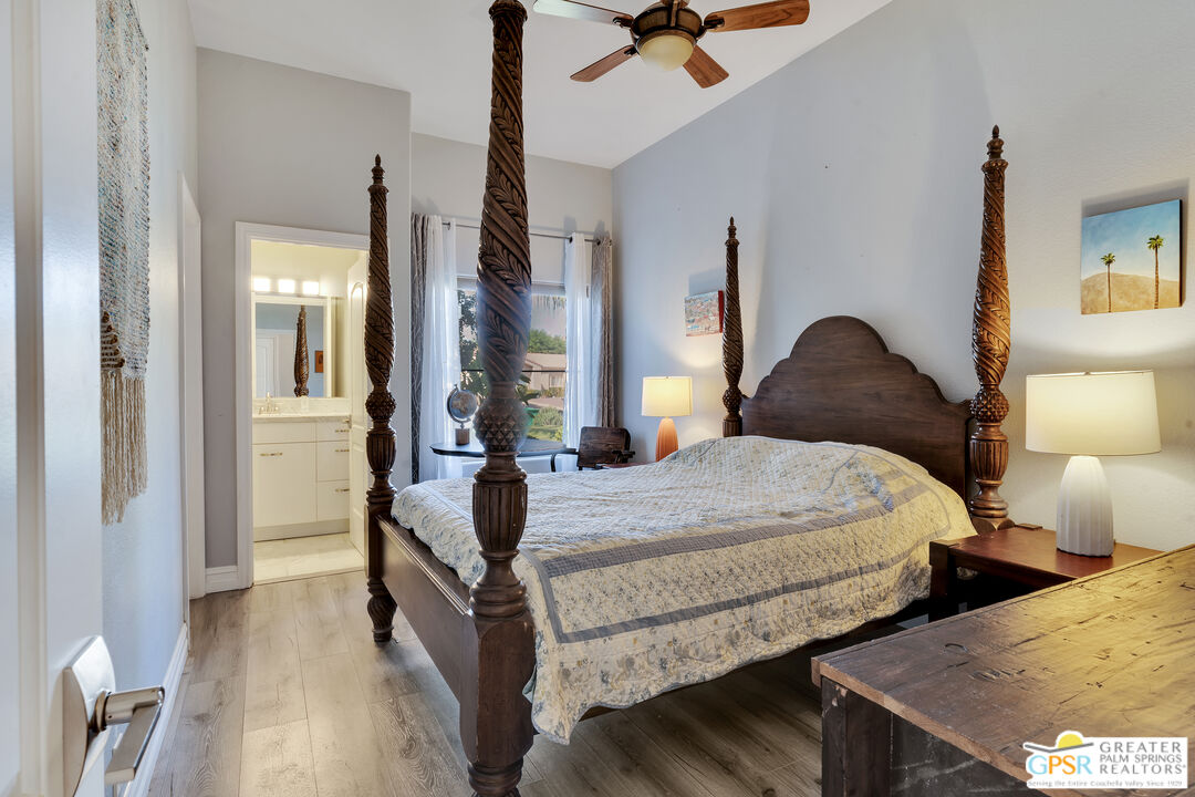 68315 Riviera Road Cathedral City, CA 92234 - Photo 18 of 33 a bedroom with bed and window